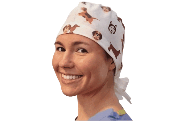 Smiling medical professional wearing a patterned disposable scrub cap