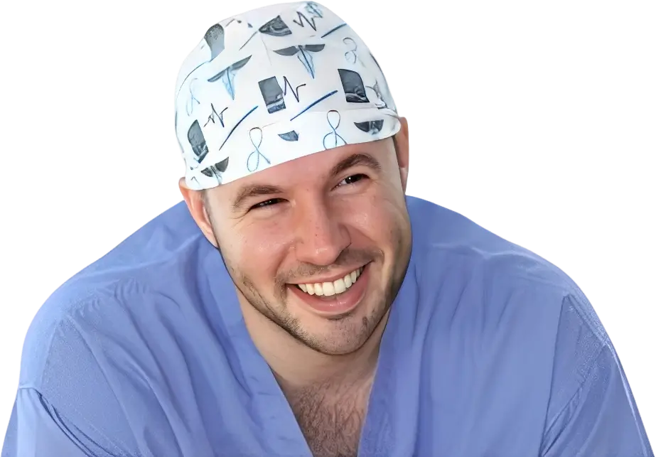 Smiling man in medical scrubs and a patterned surgical cap.